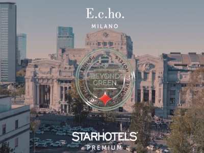 Veduta di Milano con la Stazione Centrale e il logo trasparente “Beyond Green” in primo piano